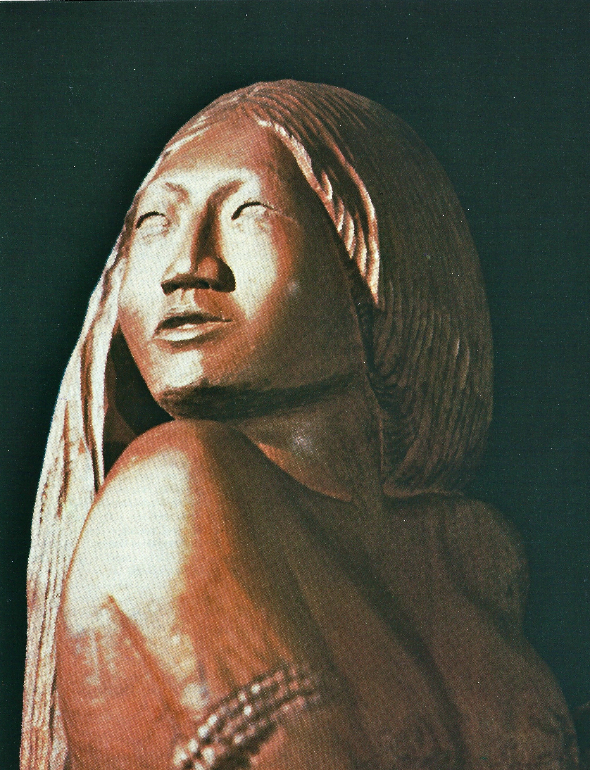 "Okoné", "Viens!". Statue d'ébène, réalisée par l'artiste surinamais-chinois Paul Woei. in "Voici Jésus l'Emmanuel. La venue de Jésus dans l'art et la Bible", Hans-Ruedi Weber, Labor et Fides / Conseil Oecuménique des Eglises, 1988